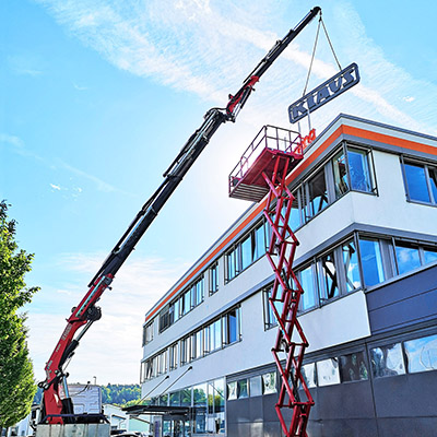 Large view of the company building with crane and lifting platform